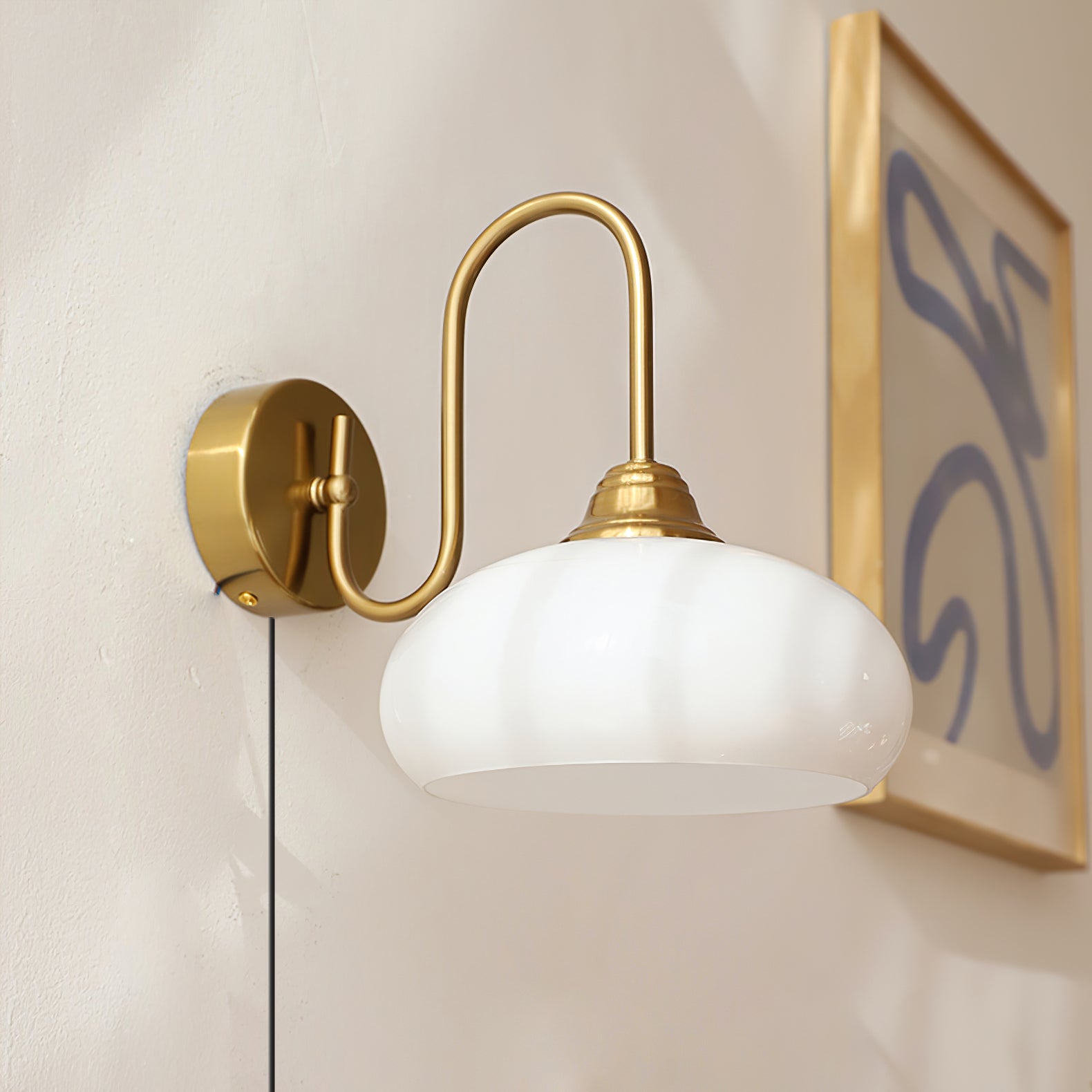 Modern Plug-in Wall Lamp with Clear Glass Shade and Brass Finish
