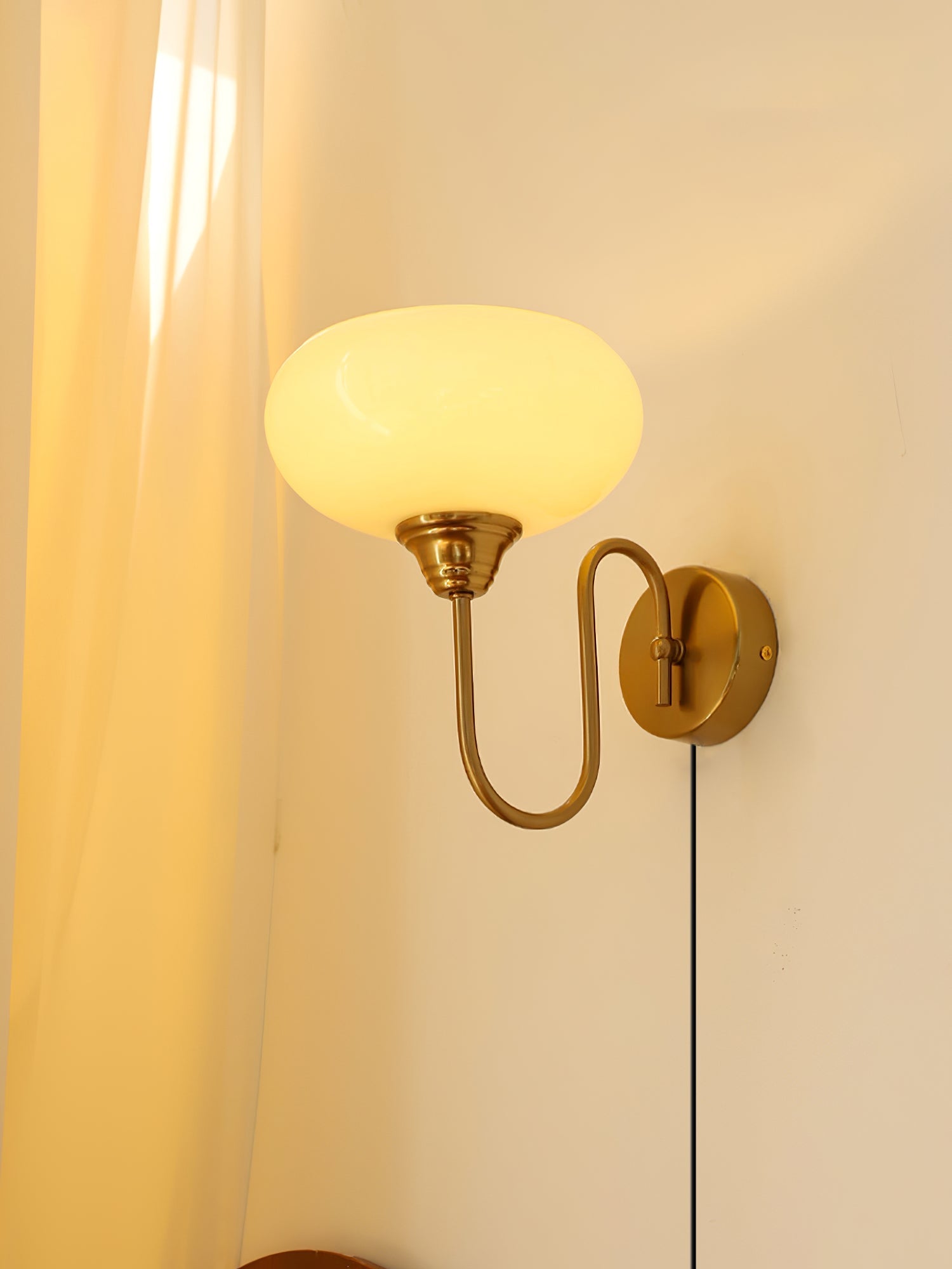 Modern Plug-in Wall Lamp with Clear Glass Shade and Brass Finish