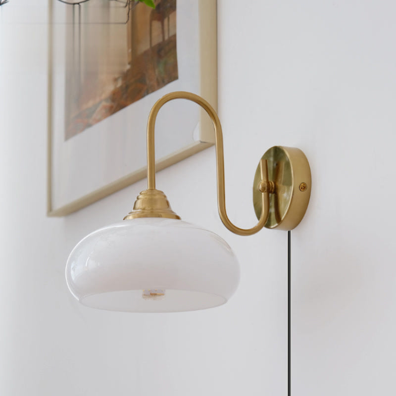 Modern Plug-in Wall Lamp with Clear Glass Shade and Brass Finish