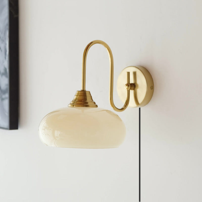 Modern Plug-in Wall Lamp with Clear Glass Shade and Brass Finish